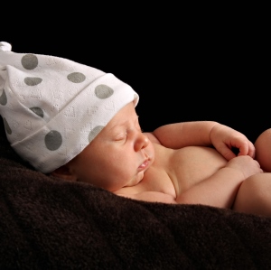 baby sleeping with spotted hat on