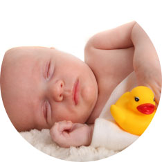 sleeping baby with rubber duck