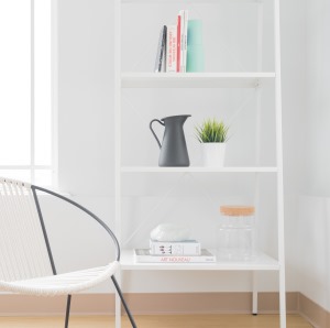 chair next to simple bookcase