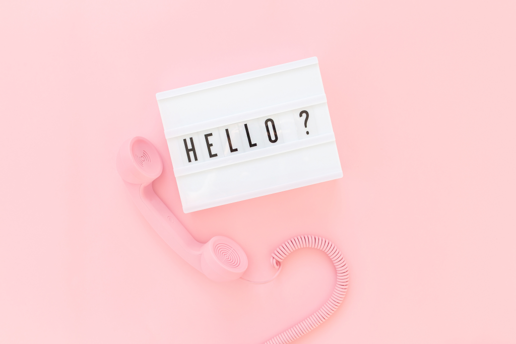 Pink telephone handset - hello