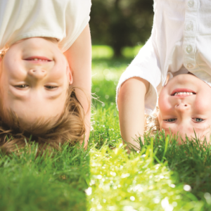 two children doing handstands