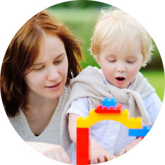 child playing with toy bricks