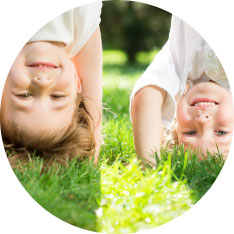 two children doing handstands