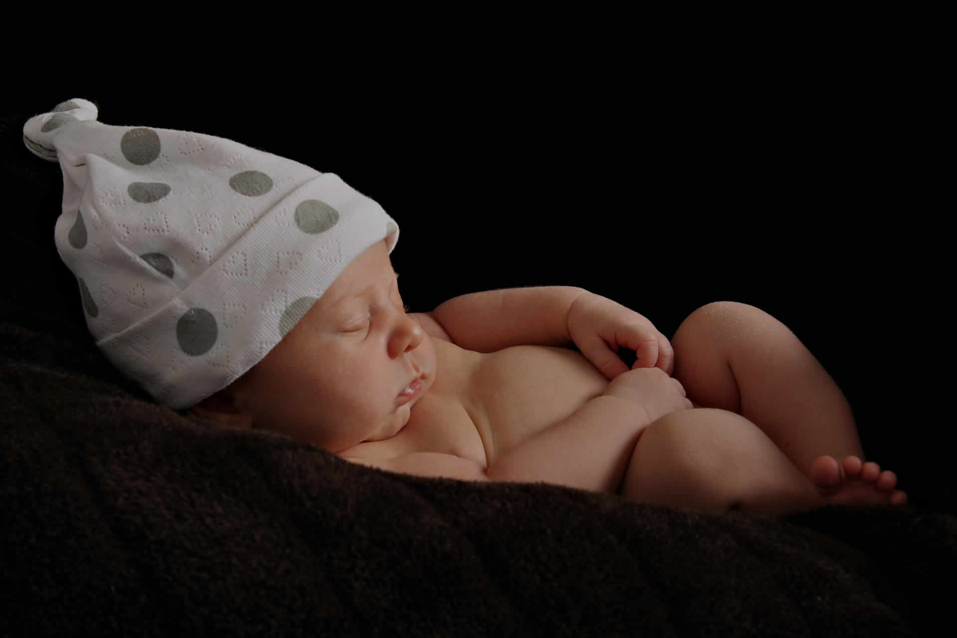 Newborn resting peacefully during the early family stage