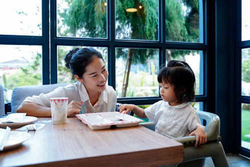 Toddler enjoying a calm, connected moment with a trusted carer